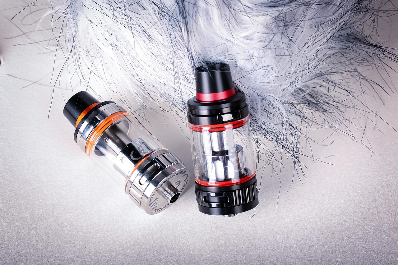 Assorted vape accessories including drip tips, cables and cases